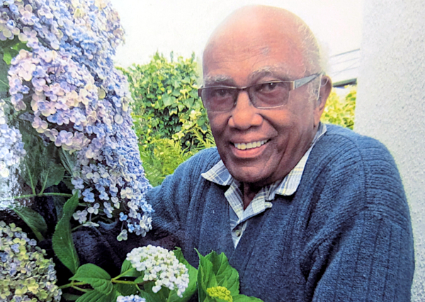 Keith in his garden at home in South Brent, Devon, UK.
